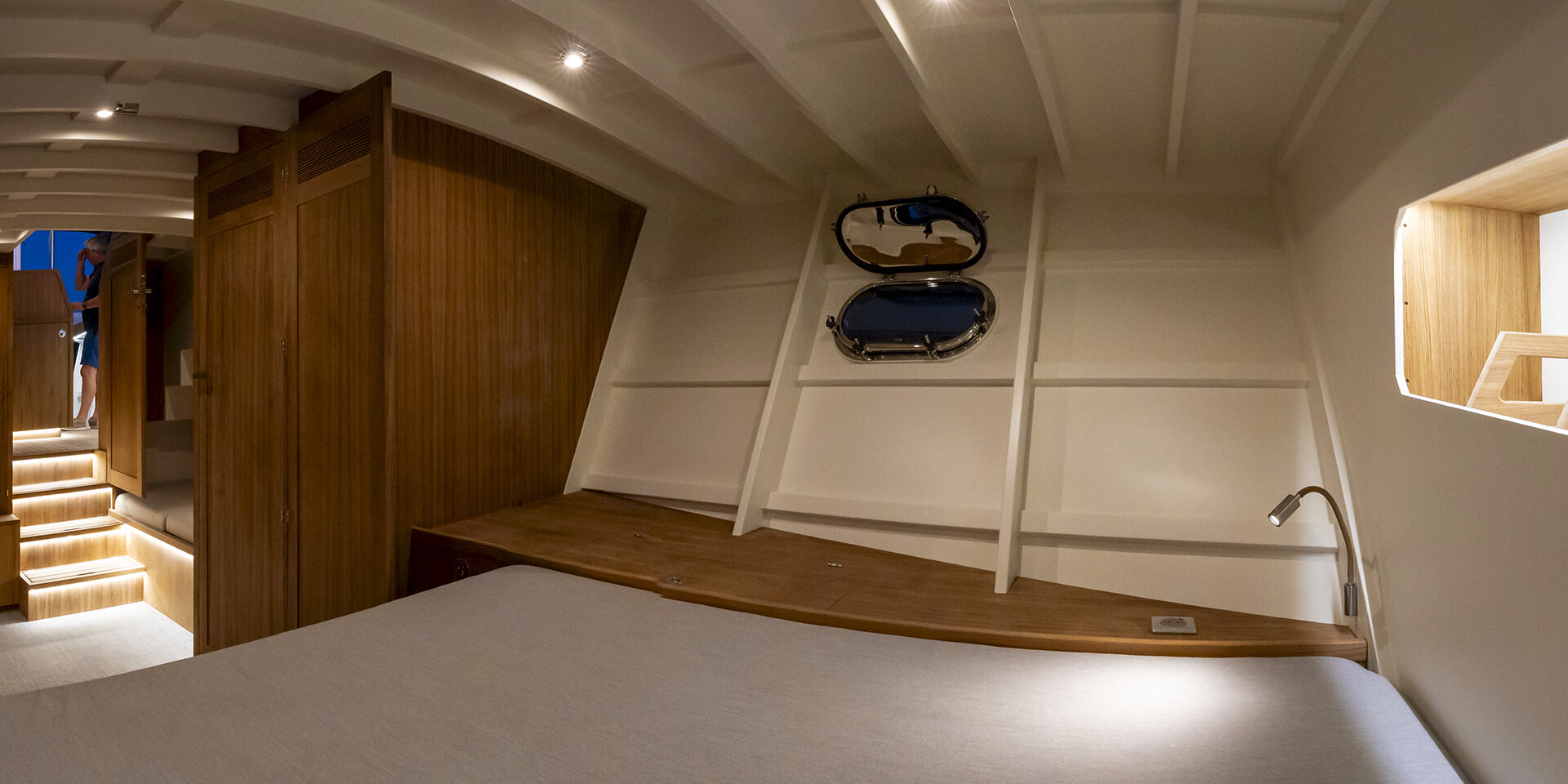 Bedroom inside ‘Chaloupe’ with wooden furnishings