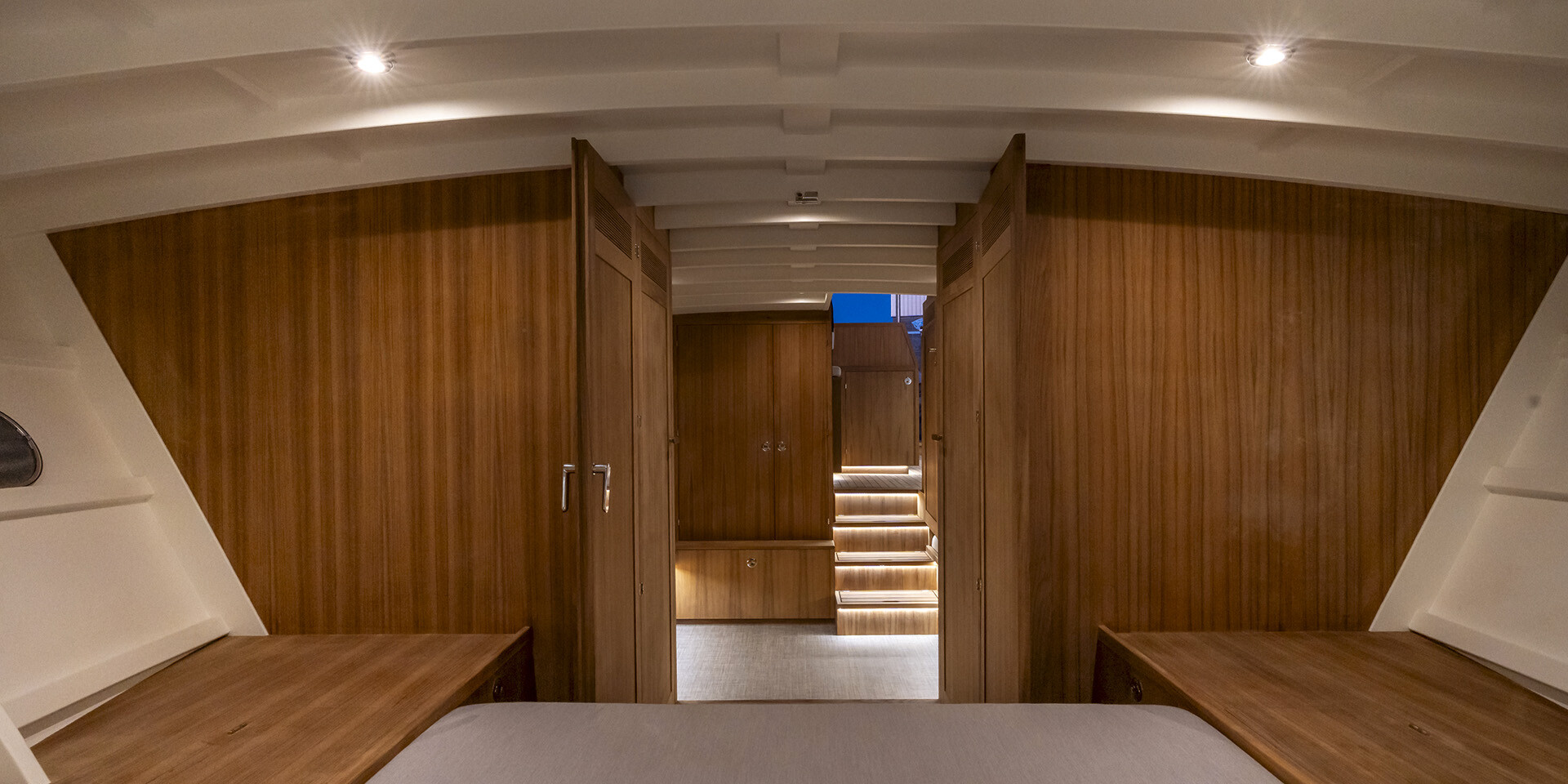 Bedroom inside ‘Chaloupe’ with wooden furnishings