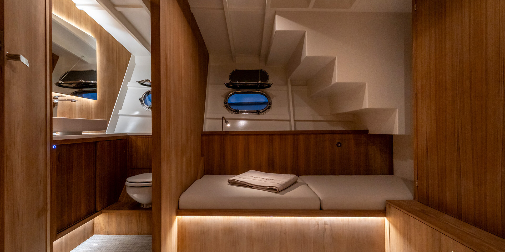 Bedroom inside ‘Chaloupe’ with wooden furnishings